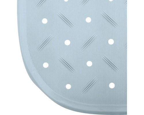 Detail einer Duschmatte mit Rillen und Löchern