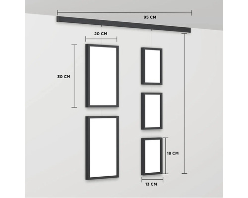 Bildergalerie mit Schiene zur Wandmontage und mehreren Rahmen in unterschiedlichen Größen