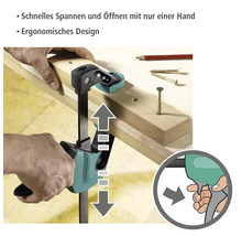 Wolfcraft Einhandzwinge im Einsatz zum Fixieren von Werkstücken.