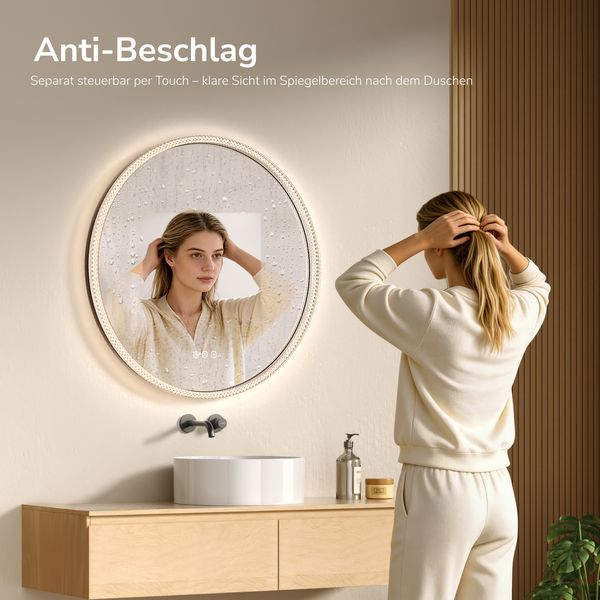 Runder LED-Badezimmerspiegel mit Anti-Beschlag-Funktion über einem Aufsatzwaschbecken und Holzunterschrank in einem modernen Badezimmer.
