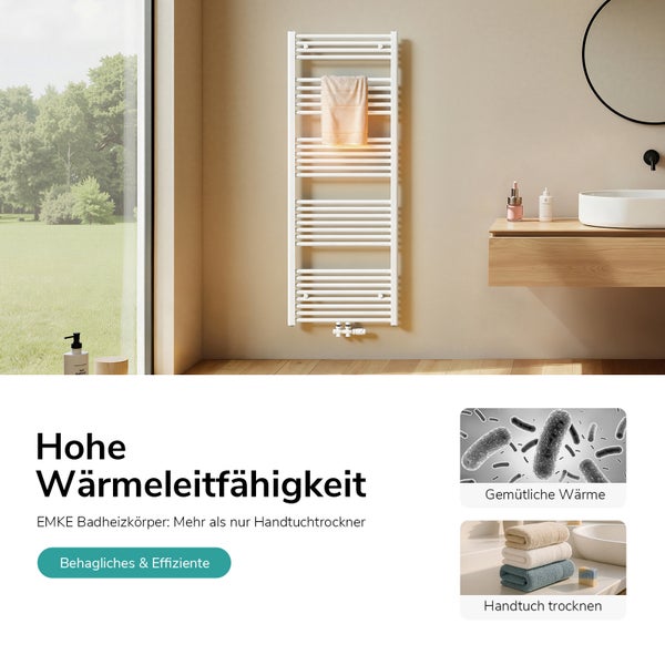 Weißer Heizkörper im Badezimmer mit Handtuch zum Trocknen.