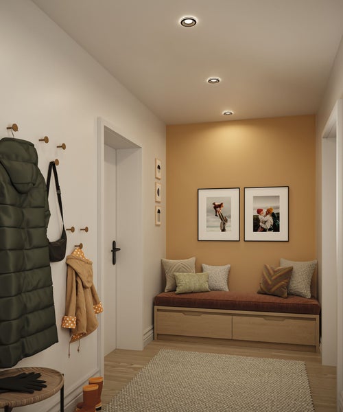 Eingangsbereich mit Garderobe, Sitzbank mit Kissen, Teppich und Deckenleuchten