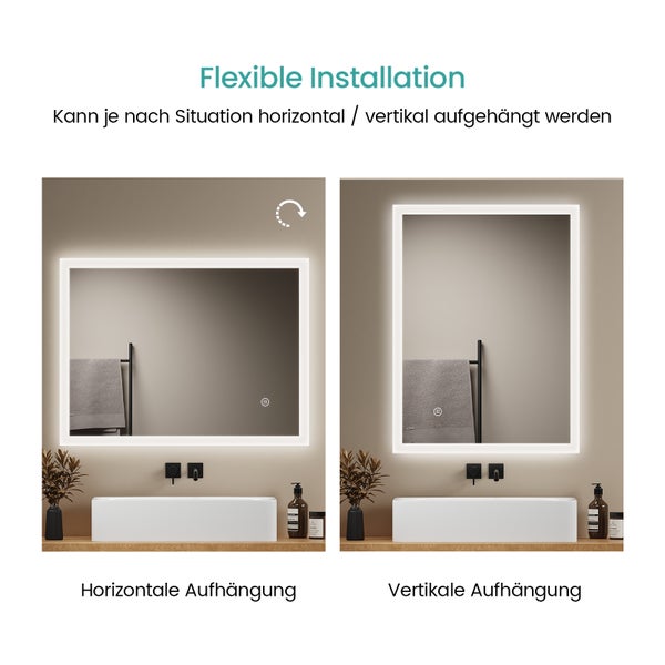 Beleuchteter Badezimmerspiegel mit Anti-Beschlag-Funktion durch Heizplatte, Frau vor Waschbecken mit schwarzer Armatur.