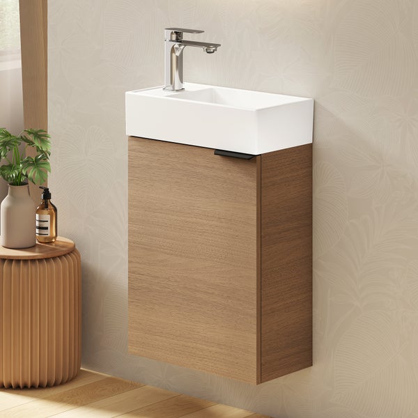 Waschtischkombination mit Unterschrank und Armatur an der Wand montiert