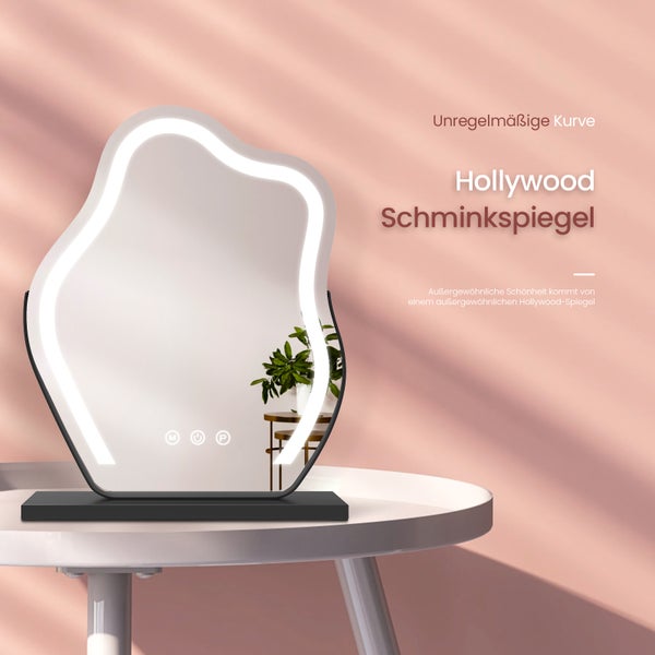 Hollywood Schminkspiegel mit unregelmäßiger Form und LED-Beleuchtung auf einem Tisch