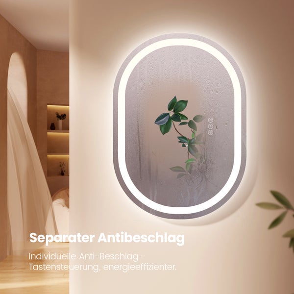 Ovaler Badspiegel mit LED Beleuchtung und Antifog Funktion in einem hellen Badezimmer.