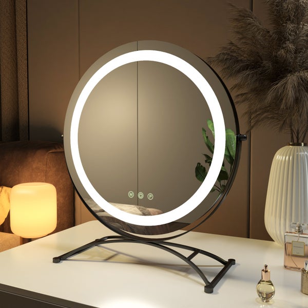 Runder Kosmetikspiegel mit LED-Beleuchtung auf einem Tisch