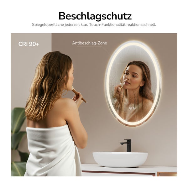 Ovaler Badezimmerspiegel mit integrierter Beleuchtung, Antibeschlag Funktion und Touch Steuerung über einem Waschbecken.