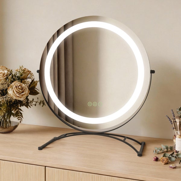 Runder Kosmetikspiegel mit LED-Beleuchtung auf einem Schminktisch