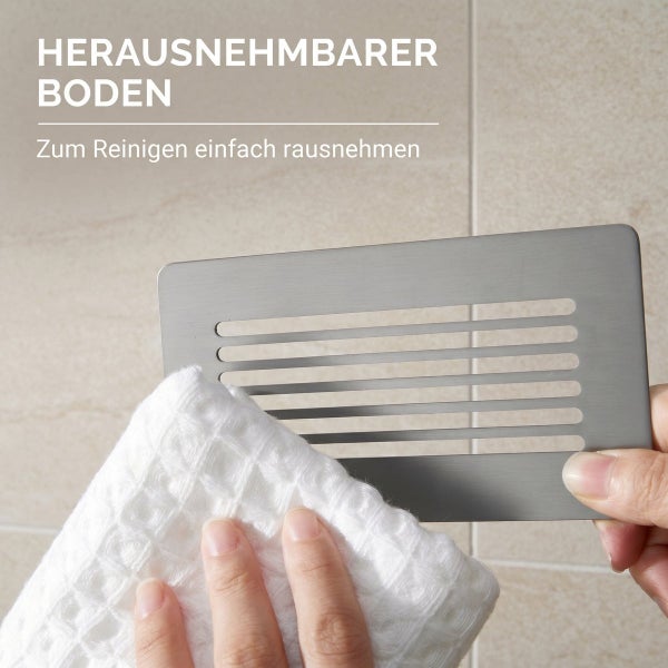 Herausnehmbarer Boden für Duschablage mit geschlitztem Design aus Edelstahl, wird mit einem Tuch gereinigt.