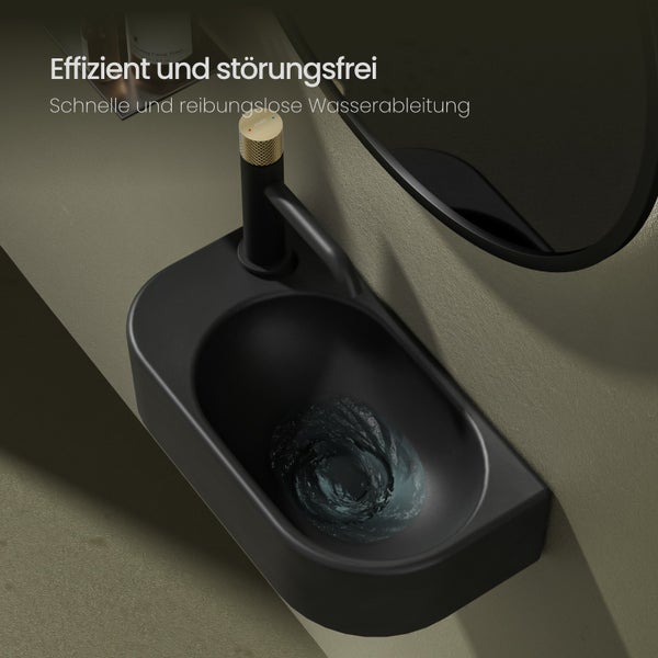 Schwarzes Waschbecken mit Wasserablauf