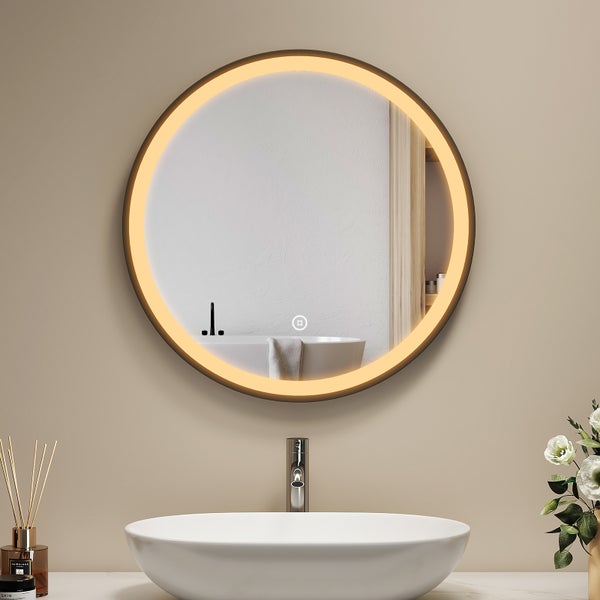 Runder Badezimmerspiegel mit LED Beleuchtung und Touch Sensor über einem Aufsatzwaschbecken im modernen Badezimmer.