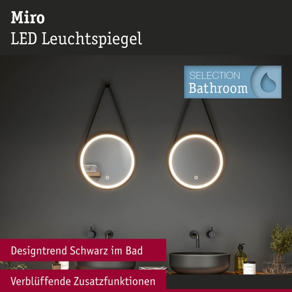 Badezimmer mit zwei runden LED-Leuchtspiegeln über Aufsatzwaschbecken