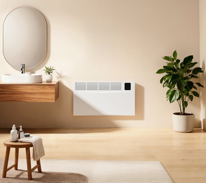 Helles Badezimmer mit Waschbecken, Spiegel, Handtuch, Hocker, Zimmerpflanze und Wandheizung.