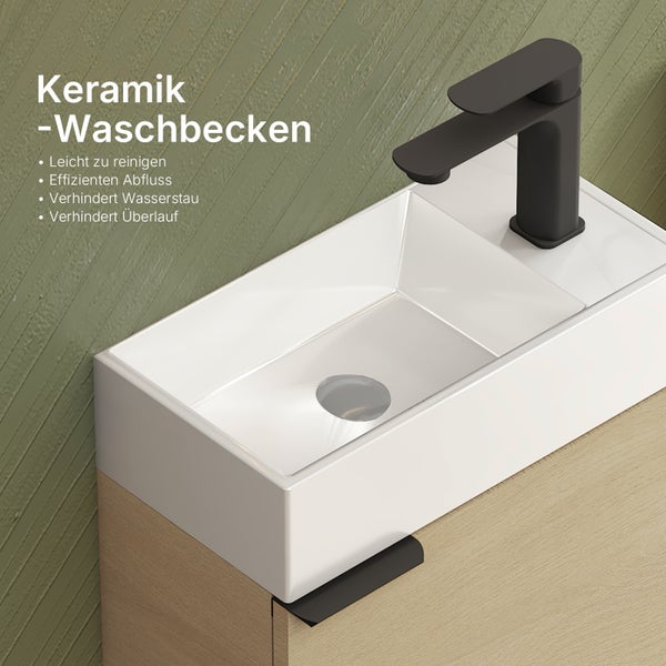 Keramik Waschbecken mit schwarzer Armatur auf einem Holzunterschrank