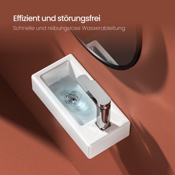 Rechteckiges Aufsatzwaschbecken aus Keramik mit verchromtem Wasserhahn und ablaufendem Wasser