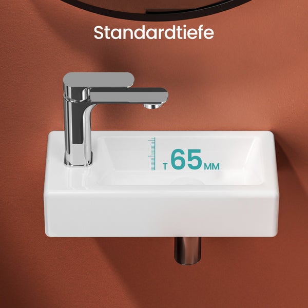 Keramikwaschbecken in Weiß mit Armatur und Tiefenangabe 65 Millimeter