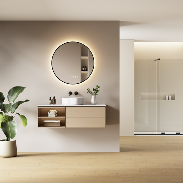 Modernes Badezimmer mit Waschtisch, rundem LED Spiegel und Dusche in einem minimalistischen und organischen Design.