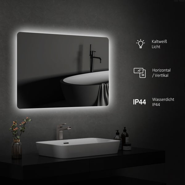 Modernes Badezimmer mit beleuchtetem Spiegel, Waschbecken und Badewanne