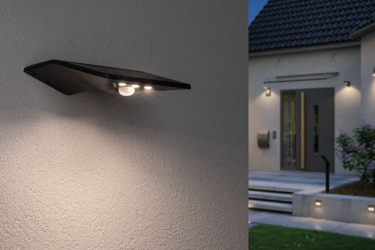 Moderne Aussenwandleuchte an Hauswand mit Beleuchtung