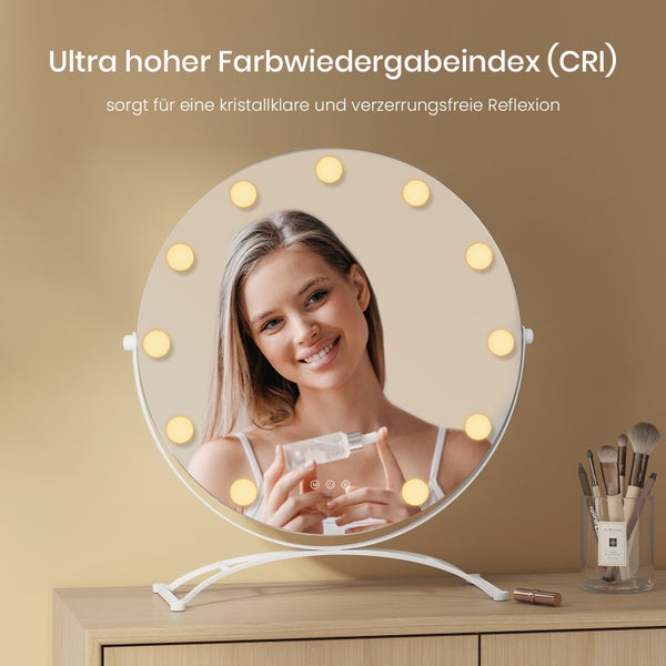 Runder Kosmetikspiegel mit Beleuchtung auf einem Tisch mit einer Frau im Spiegelbild