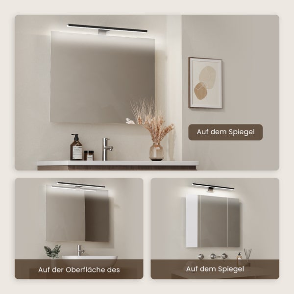 Badezimmer mit Spiegel, Waschbecken und Beleuchtung