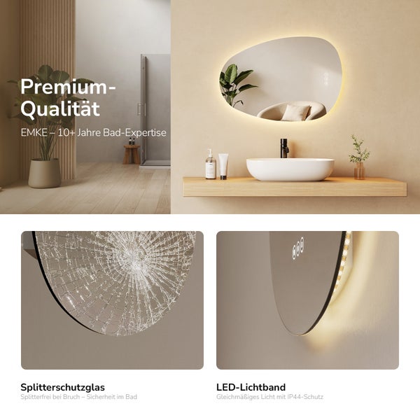 EMKE LED-Badezimmerspiegel in asymmetrischer Form mit Splitterschutzglas und IP44-Lichtband über einem Waschbecken in modernem Badezimmer.
