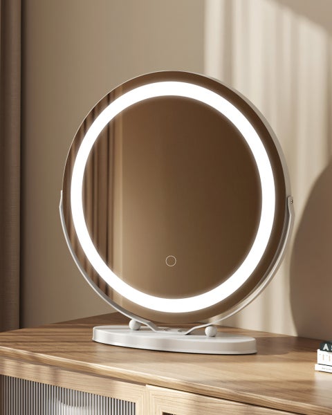 Runder Kosmetikspiegel mit LED-Beleuchtung auf einem Schminktisch