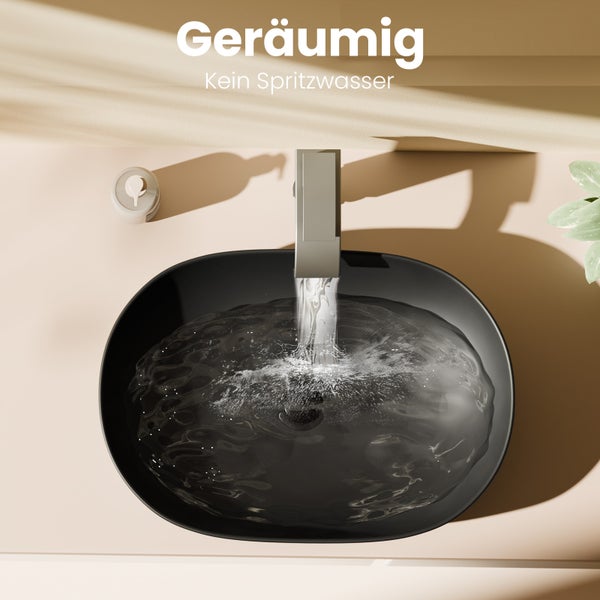 Draufsicht auf ein ovales, schwarzes Aufsatzwaschbecken mit fließendem Wasser aus einer modernen Armatur.