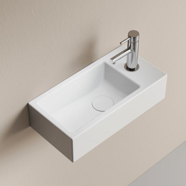 Wand-Handwaschbecken rechteckig aus Keramik für Gäste-WC mit verchromter Einhebel-Mischbatterie rechts und rundem Ablaufdeckel.