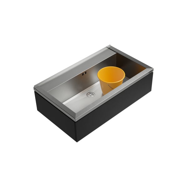 Edelstahlspüle mit schwarzem Unterschrank und gelbem Eimer