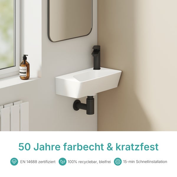 Waschbecken mit Armatur und Ablaufgarnitur im Badezimmer
