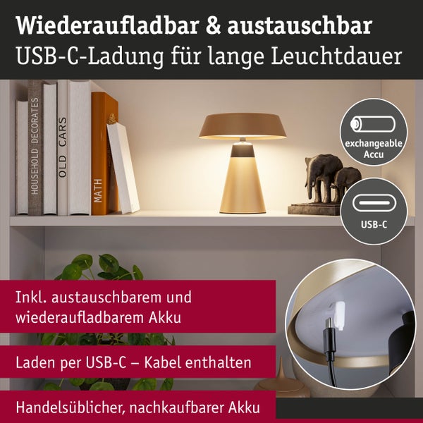 Aufsatzleuchte mit USB-C-Ladefunktion und austauschbarem Akku auf einem Regal mit Büchern und Dekoration