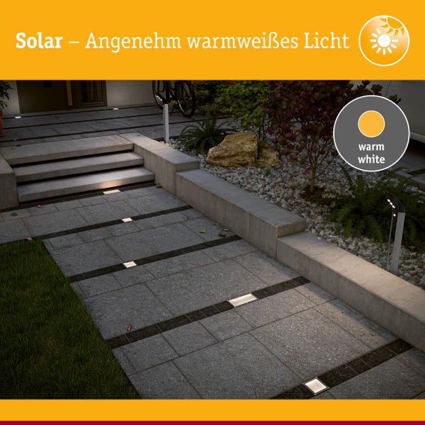 Beleuchteter Gartenweg mit eingelassenen Solarleuchten und warmweissem Licht.