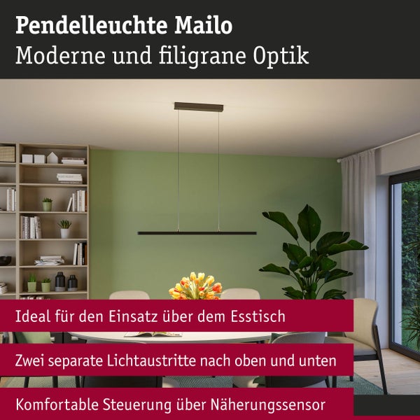 Mailo Pendelleuchte über einem Esstisch in einem hellen Raum mit Bücherregal