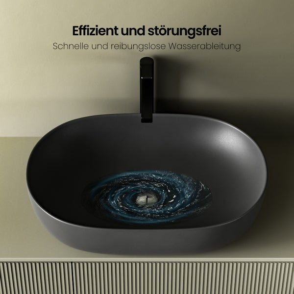 Aufsatzwaschbecken in ovaler Form mit Wasserwirbel-Design und schwarzer Armatur auf Waschtisch