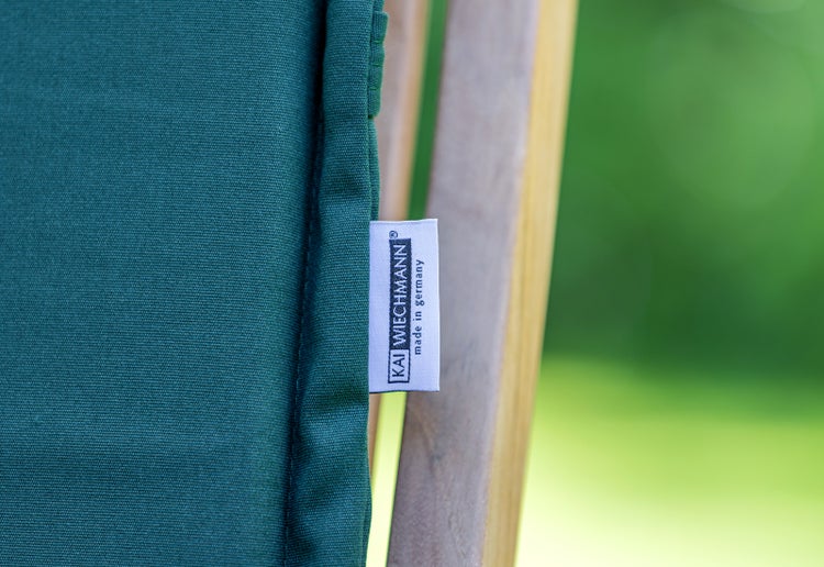 Kai Wiechmann Logo auf einem grünen Kissen mit dem Hinweis Hergestellt in Deutschland