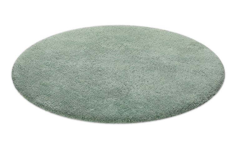 Runder, hellgrüner Hochflor-Teppich mit weicher Oberfläche.