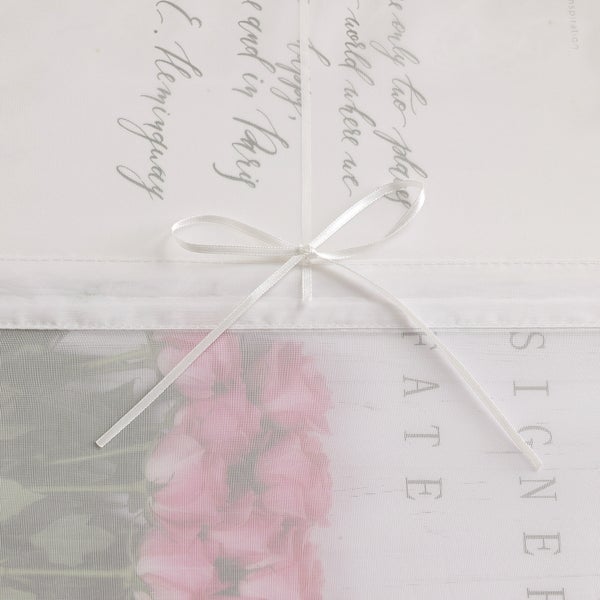 Dekoratives Rollo mit Blumenmuster und Schleife