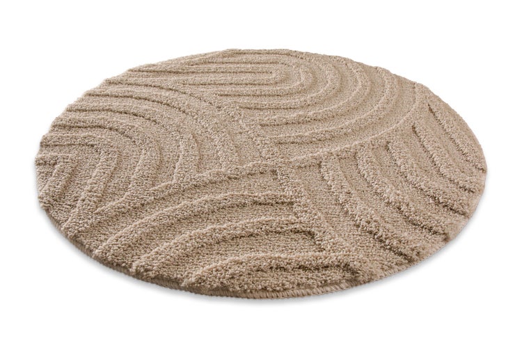 Runder Badvorleger mit Hochflor und Wellen-Reliefmuster.