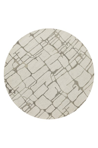 Runder Teppich mit geometrischem Muster aus abstrakten Linien.