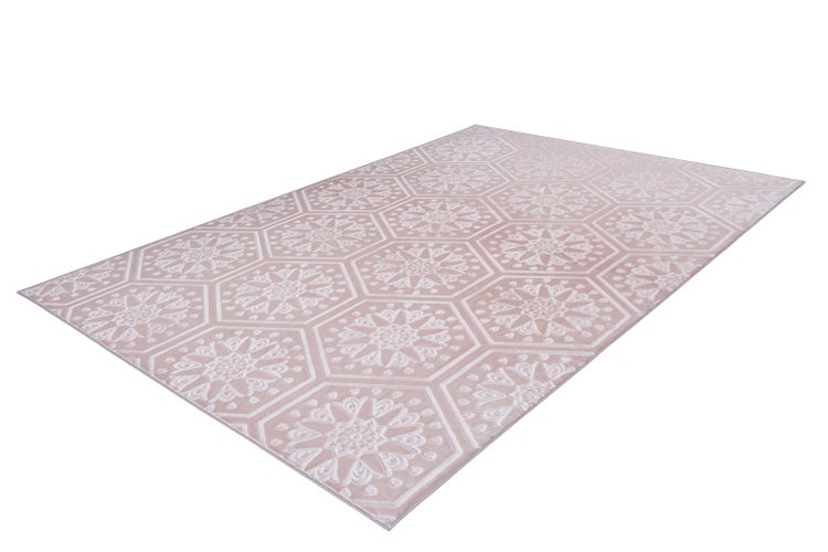 Rechteckiger Teppich in Rosa und Weiß mit Sechseck-Muster und floralen Ornamenten.