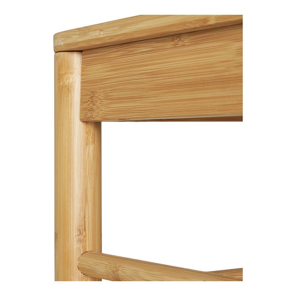 Nahaufnahme einer Möbelecke aus Bambus mit sichtbarer Maserung und runden Beinen.