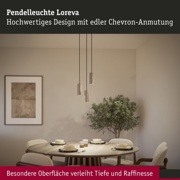 Wohnzimmer mit modernem Kamin und hängender Ringlampe, gemütliche Sitzgruppe mit Sofa und Couchtisch in heller, wohnlicher Atmosphäre.