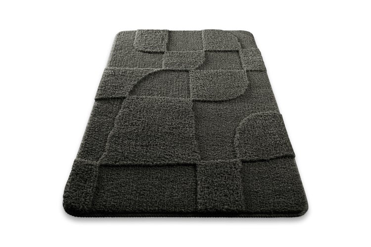 Nahaufnahme eines Teppichs aus 100 Prozent Polyester mit einem Frosch mit Krone und einem Herzsymbol.