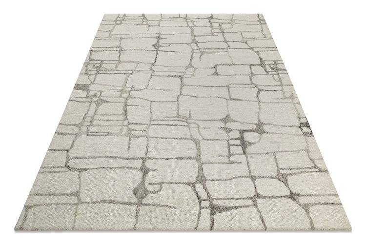 Rechteckiger Teppich mit modernem abstraktem geometrischem Muster aus unregelmäßigen Linien.