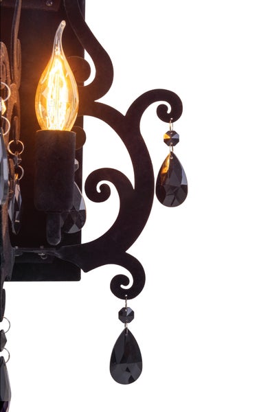 Wandleuchte mit dekorativen Kristallen und einer Glühbirne.