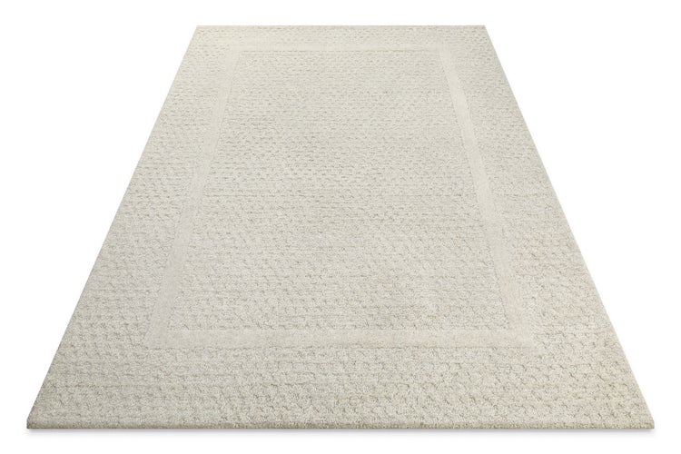 Strukturierter Teppich mit Bordüre.
