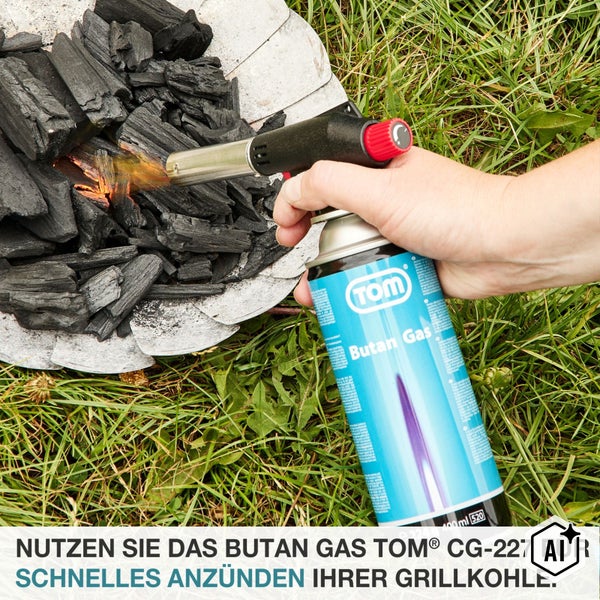 TOM Butangas Kartusche CG 227 mit Gasbrenner zum Anzünden von Grillkohle im Außenbereich.