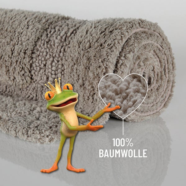 Eingerollte Badematte aus 100 Prozent Baumwolle mit weicher, flauschiger Struktur und einem Frosch mit Krone.